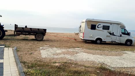 Tractor-helps-and-rescues-trapped-tourists-camper-van-from-soft-sandy-beach