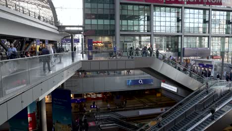 Inside-Berlin-Central-Main-Railway-Station-On-Upper-Level-Looking-Over-Railing-At-Staircase-And-Escalator