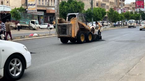Government-workers-fixing-road-in-the-day-public-street-Safety-hazard