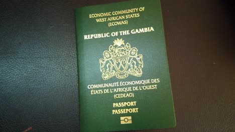 Gambia-biometric-passport-slow-zoom-out-view,-Republic-of-The-Gambia---Gambian-passport