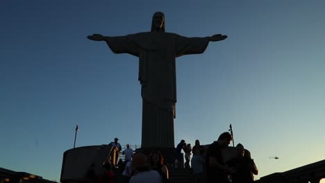 Crowd-of-tourists-standing-in-front-of-the-iconic-landmarks-Christ-the-Redeemer-statue-against-blue-sky