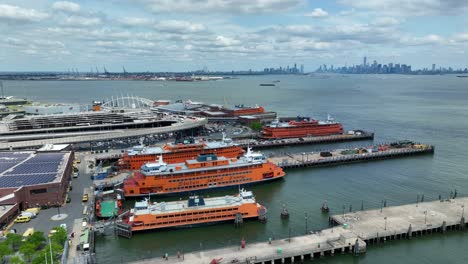 Staten-Island-Ferry-boats-and-terminal-with-New-York-City-skyline-in-distance