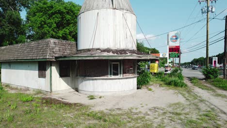 Aerial-view-flying-backwards-from-the-milk-can-building-in-Manville