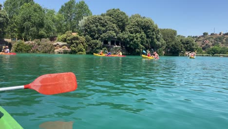 People-kayaking-in-the-turquoise-waters-of-a-lake-on-a-sunny-day-in-Spain