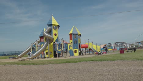Children-having-fun-at-the-play-area-Lowgreen-Ayr-Seafront,-locked-off
