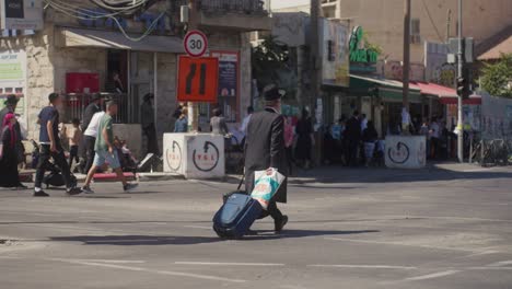 man-walking-on-street-before-sabbath,-downtown-Jerusalem,-Israel