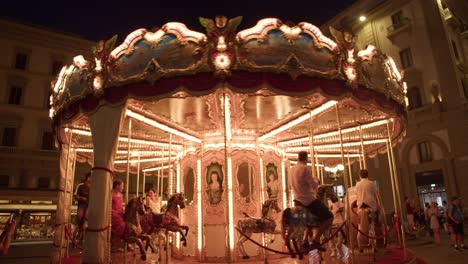 Merry-Go-Round-Carousel-in-Florence,-Italy-Downtown-Piazza-della-Repubblica-Active-Medium-Shot-with-People
