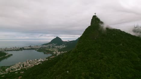 Drone-flyover-Corcovad-Hill-with-Christ-the-Redeemer-shrouded-in-fog,-Rio-de-Janeiro-Landscape