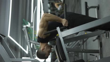 Athlete-man-training-force-push-up-and-pull-up-exercise-on-bars-in-gym