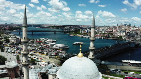 Aerial-revealing-view-historical-famous-Sultanahmet-Mosque-minarets-and-dome-view-with-cityscape-panorama