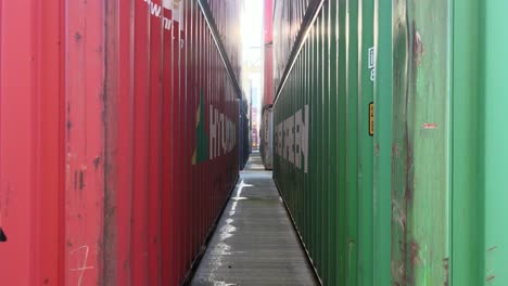 POV-of-walkway-path-between-two-huge-containers-loaded-on-port-in-Manheim