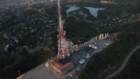 Aerial-Hollywood-sign-and-Antenna-on-an-helicopter-sunrise-from-the-back-45-degrees-angle-facing-downtown-Los-Angeles