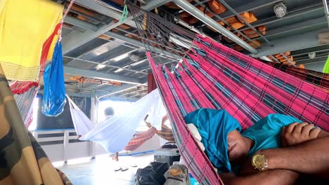People-sleep-in-hammocks-while-traveling-on-a-boat-crossing-the-Amazon-River-in-Brasil