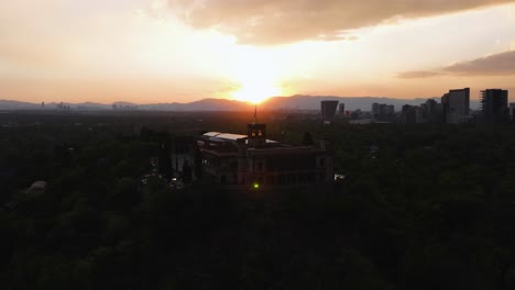 Aerial-view-approaching-the-Chapultepec-castle,-sunny-evening-in-Mexico-city
