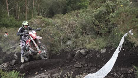 Motocross-Rider-Trying-Hard-To-Climb-High-Hill-In-Soil