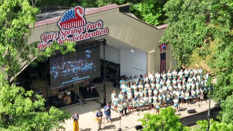 Lititz-Springs-Park-fourth-of-July-celebration-outdoor-performance-of-a-children's-choir-performing-for-the-community-members