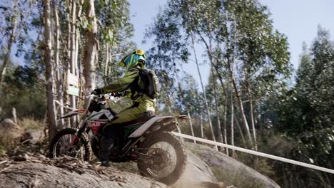 Excited-Motocross-Rider-Doing-Off-road-Successfully-In-Soil-During-Enduro-Ride