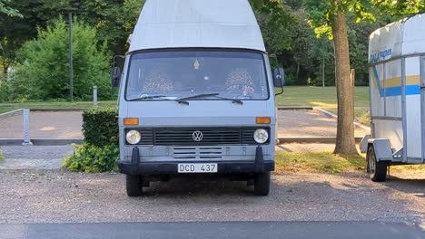 4K-60FPS-Vintage-Vanlife-Van-Old-Car-Parked-on-a-Swedish-Parking-Lot---Dolly-Shot-Zoom-In
