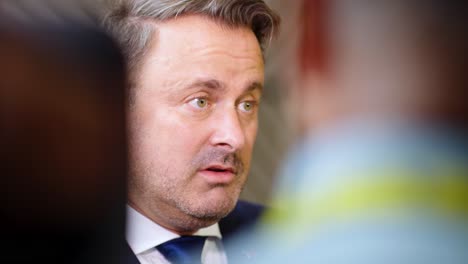 Prime-Minister-of-Luxembourg-Xavier-Bettel-giving-an-interview-during-the-European-Council-summit-in-Brussels,-Belgium---Cinematic-shot