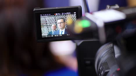 Prime-Minister-of-Poland-Mateusz-Morawiecki-giving-an-interview-during-the-European-Council-summit-in-Brussels,-Belgium---Camera-finder-view