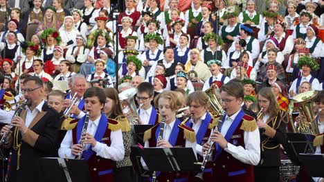 Brass-band-musicians-perform-together-with-a-folk-choir