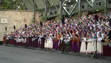The-folk-mixed-choir-members-perform-a-popular-choir-song-during-the-XXVII-Nationwide-Latvian-Song-and-XVII-Dance-Festival-pre-events-concert