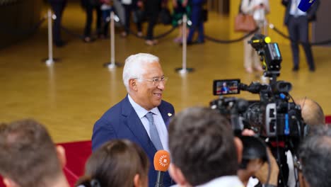 Prime-Minister-of-Portugal-António-Costa-giving-an-interview-during-the-European-Council-summit-in-Brussels,-Belgium---Slow-motion-shot