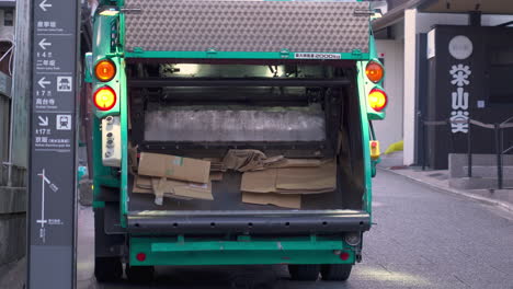 KYOTO,-JAPAN---April-4,-2023:-Recycling-garbage-collector-truck-on-duty-in-Japan