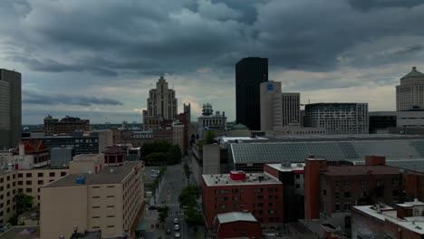 Chinatown-Drone-Montreal-Downtown-flyover-cloudy-dark-sky-flight-towards-Notre-Dame-church-in-the-center-scene-with-massive-convention-center-connected-to-metro-station-YUL0-3