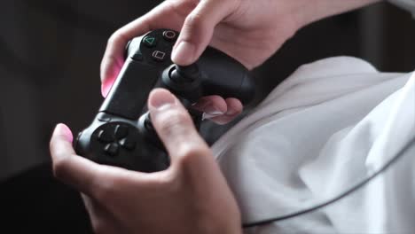 Gaming-Bliss:-Slow-Motion-Close-Up-of-Man-Playing-PlayStation-with-Wireless-Remote