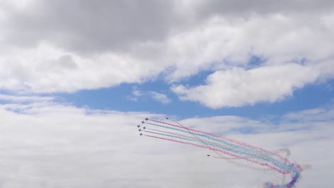 Red-Arrows-Planes-Flying-in-Formation-with-2-Planes-Barreling-Around-on-Outside-During-Air-Show-in-Swansea