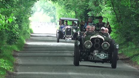 Vintage-traffic-jam-classic-cars-driving-down-an-Irish-road-in-Kildare-Ireland