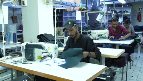 Pakistani--Male-Garment-Workers-Using-Sewing-Machines