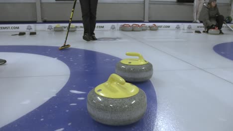 Curling-stone-hitting-another-curling-stone