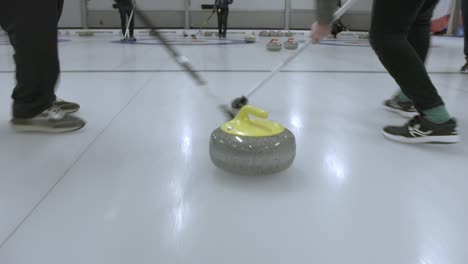 Follow-curling-players-sweeping-the-ice