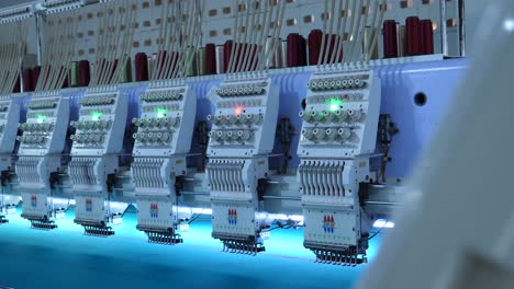 Row-Of-Automated-Fabric-Stitching-Machines-At-Garment-Factory-In-Karachi