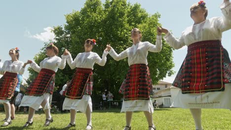 Low-camera-angle-of-Bulgarian-folk-dancers-performing-traditional-horo