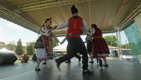 Bulgarian-dancers-dance-and-run-in-circles-on-cultural-festival-stage