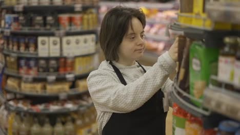 Woman-with-Down-syndrome-restocking-goods-in-a-grocery-store