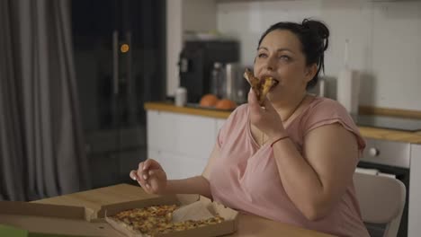 Overweighted-woman-eats-with-great-pleasure,-woman-eats-pizza,-rolls-eyes,-slow-motion