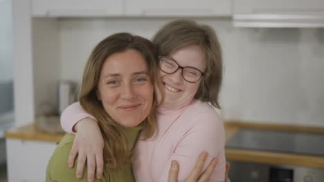 Sweet-daughter-with-disabilities-smiling-with-her-mom