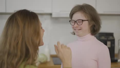 Mother-and-her-lovely-down-syndrome-daughter-make-fun-together-at-home