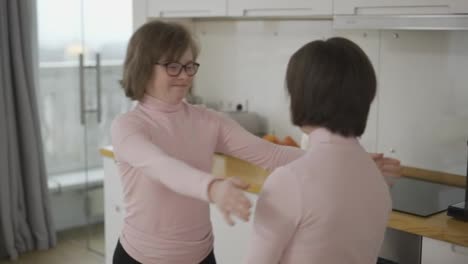 Happy-girls-with-down-syndrome-come-together-to-hug