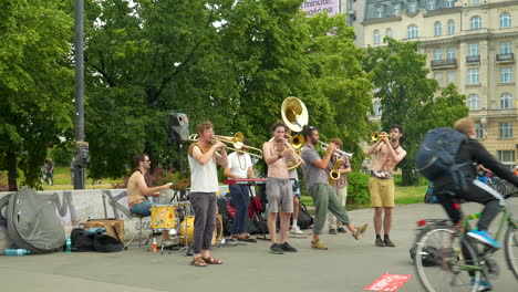 Street-performance-of-the-popular-music-group-Retropico-in-the-center-of-Warsaw-at-Wisława-Szymborska-Passage