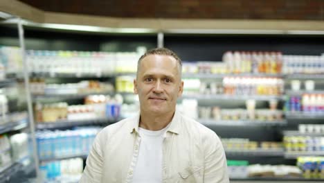 Portrait-of-and-elderly-shot-visitor.-The-man-puts-his-hands-on-his-chest.-Concept-of-going-to-the-grocery-store