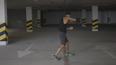 Boxer-does-training-punches-in-underground-parking