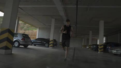 Athlete-runs-inside-the-city-parking-garage