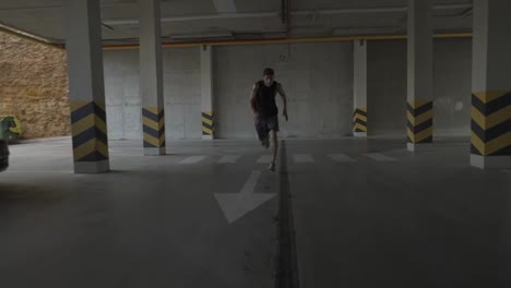 Young-man-runs-fast-inside-the-parking-garage