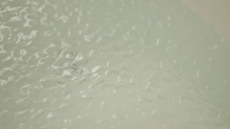 A-bath-full-with-ice-cubes,-close-up