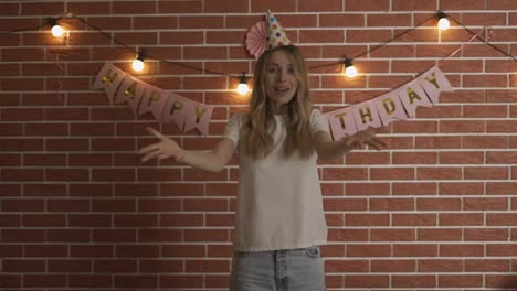 Excited-girl-shout-Happy-Birthday-on-camera-in-decorated-room